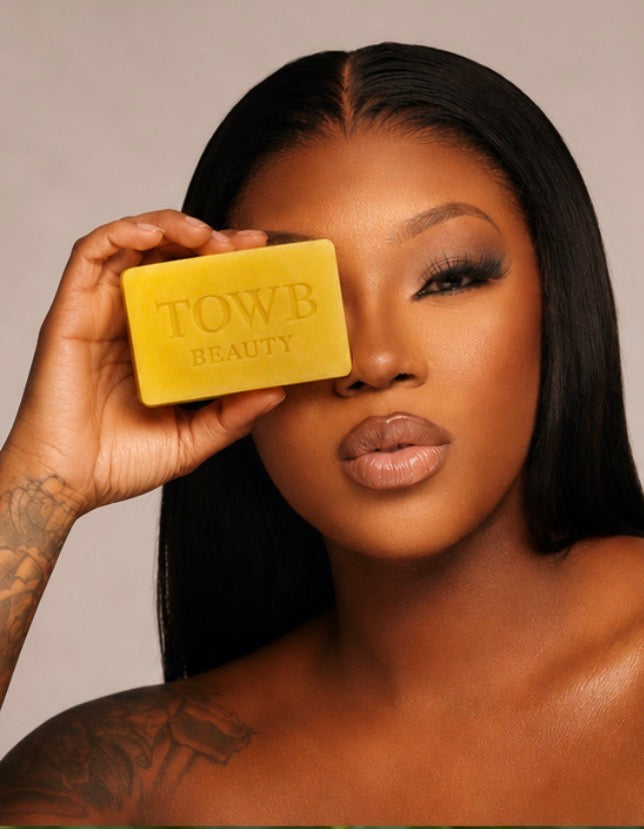 Towb Beauty model holding sulfur soap